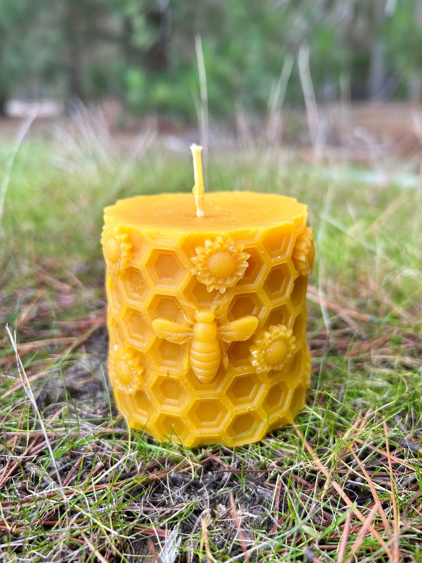 Bring the warmth of a sunlit meadow into your home with the Golden Hive Garden Candle. Hand-crafted from 100% pure New Zealand beeswax, this beautifully detailed candle features an intricate honeycomb pattern adorned with charming bees and blooming flowers. Its natural golden hue and gentle honey aroma create a soothing, nature-inspired atmosphere perfect for any room.