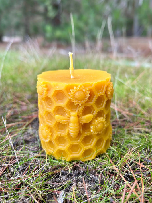 Bring the warmth of a sunlit meadow into your home with the Golden Hive Garden Candle. Hand-crafted from 100% pure New Zealand beeswax, this beautifully detailed candle features an intricate honeycomb pattern adorned with charming bees and blooming flowers. Its natural golden hue and gentle honey aroma create a soothing, nature-inspired atmosphere perfect for any room.