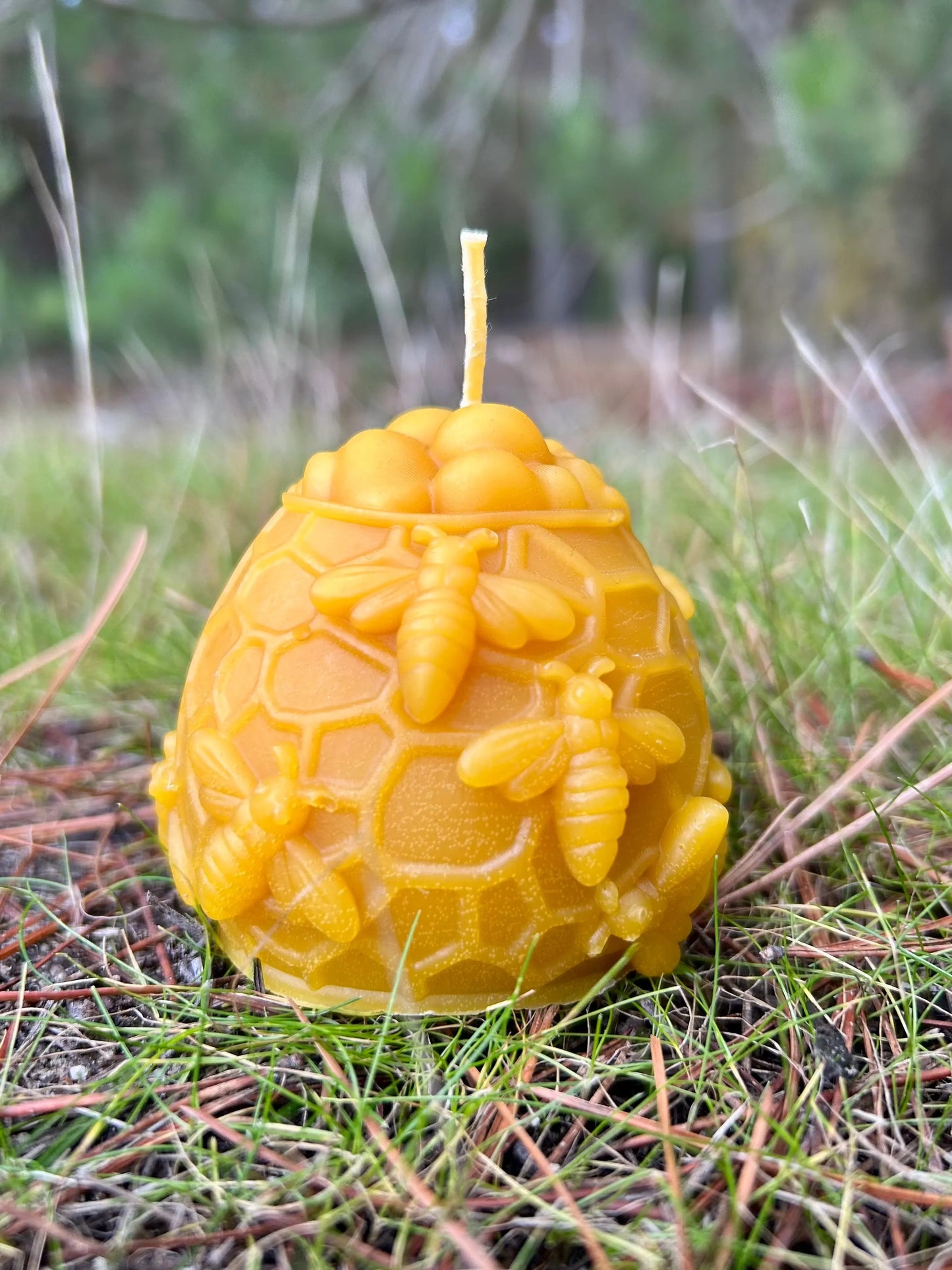 Handcrafted from 100% pure New Zealand beeswax, the Honey Hive Candle celebrates the beauty and importance of bees. Designed in the shape of a honeycomb dome and detailed with sculpted bees, it brings a warm, nature-inspired touch to any home. Each candle is hand-poured in small batches, offering a gentle, naturally sweet honey aroma without artificial fragrances, dyes, or additives.