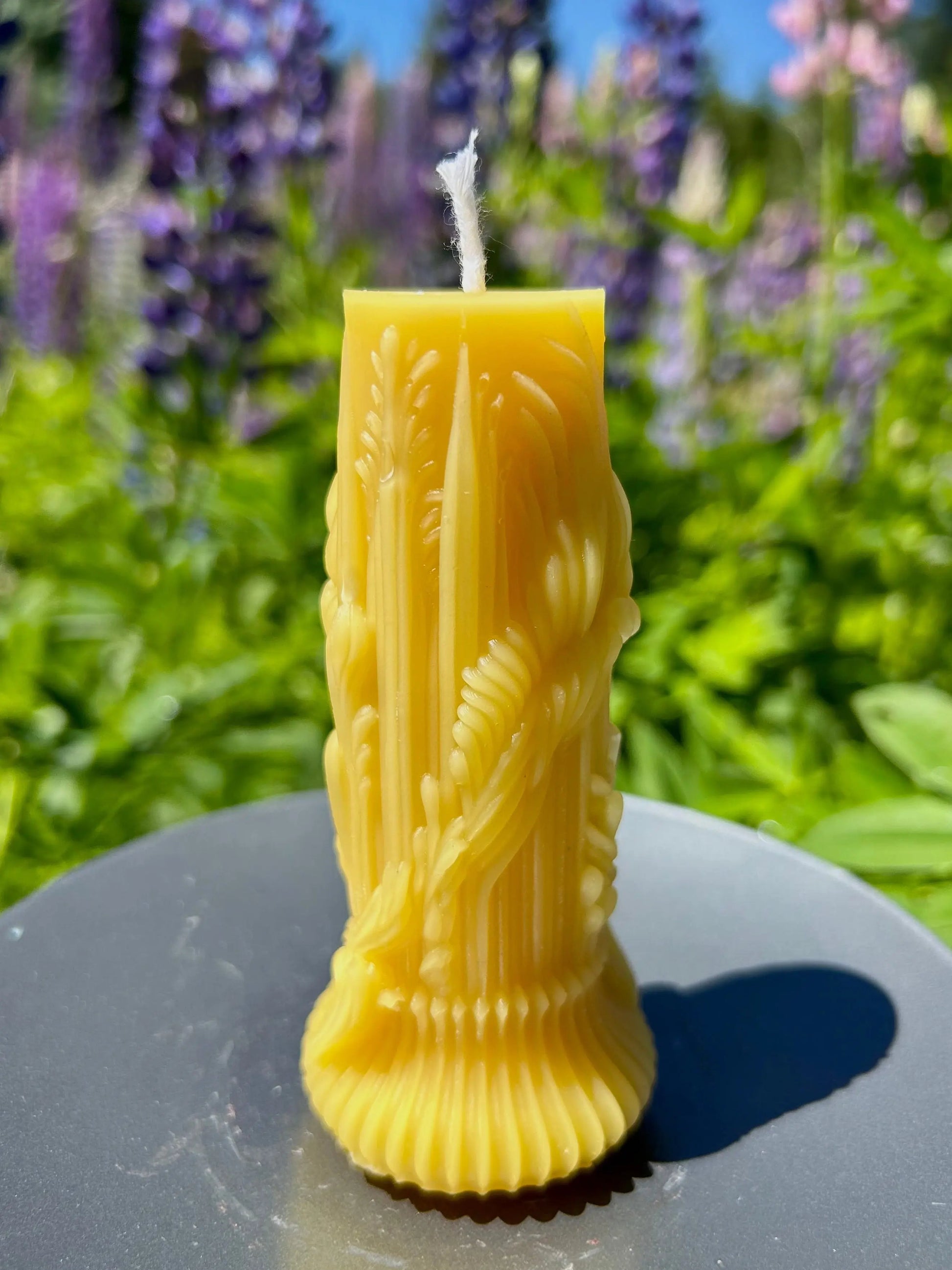 Our Heirloom Honey Pillar Candle is hand-poured using 100% pure beeswax, featuring a timeless pillar shape with subtle floral detailing.