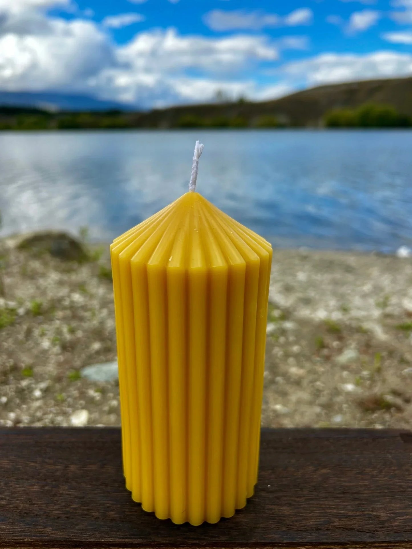 Enhance your home with the Golden Column beeswax candle, a tall and elegant sculptural piece handcrafted from 100% pure, ethically sourced New Zealand beeswax. Designed to burn cleanly and slowly, it releases a naturally soft honey aroma with no added fragrances, dyes, or toxins.

Available in four sizes — Small, Small Tall, Medium, and Large — the Golden Column candle suits a variety of spaces and styling needs. Whether used as a subtle accent or a striking centrepiece, its fluted column design and warm go