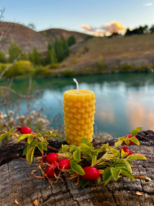 The Honeycomb Haven Pillar Candle is a beautifully textured beeswax candle inspired by the natural geometry of the hive. Featuring a striking honeycomb pattern wrapped around its entire body, this candle brings a warm, organic charm to any living space. Hand-poured in small batches using 100% pure New Zealand beeswax, it offers a clean, gentle burn and a naturally sweet honey aroma—no added scents, colours, or chemicals.