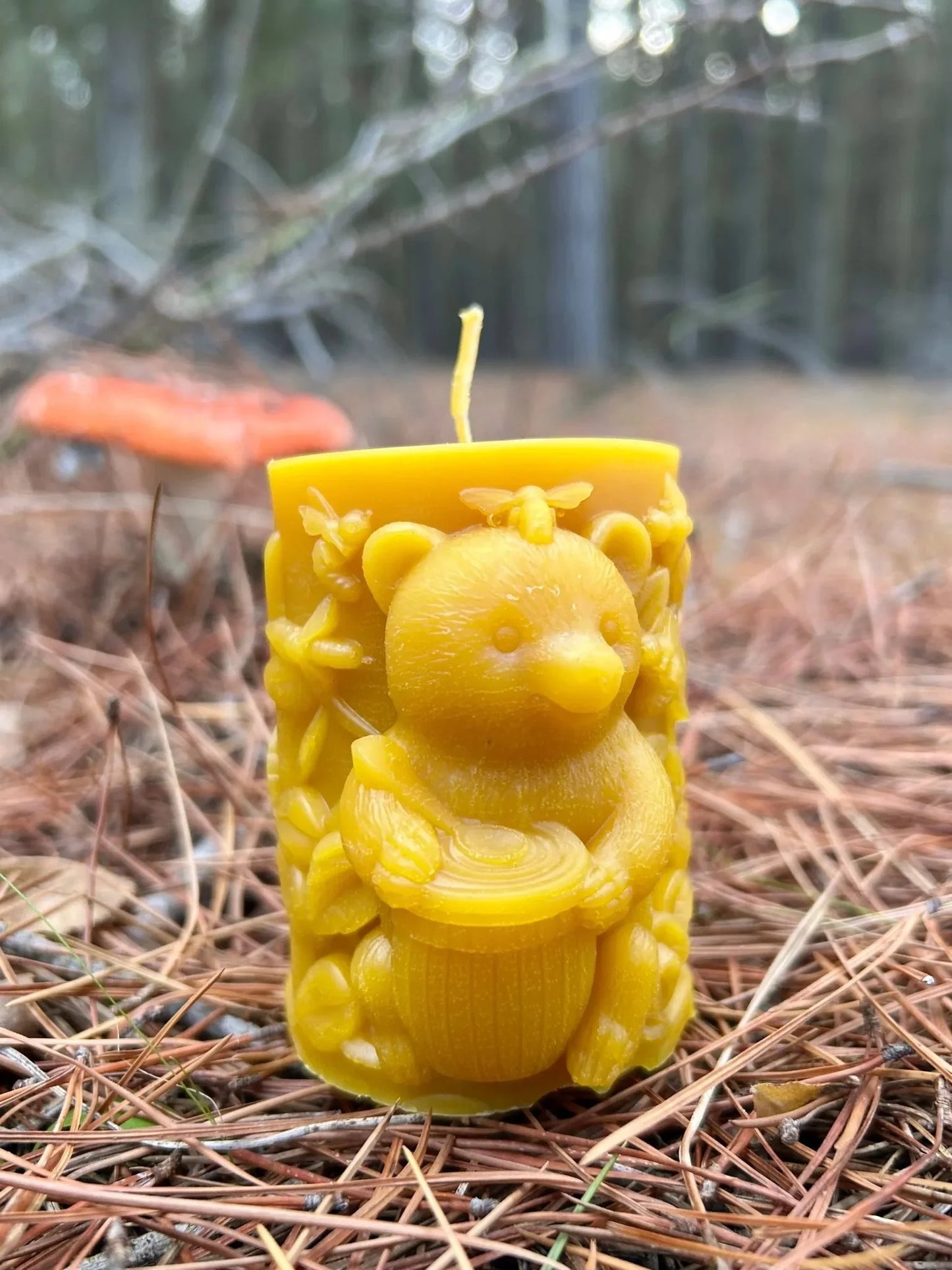 This handcrafted beeswax candle features two charming bears climbing among detailed forest leaves and blossoms, creating a warm, nature-inspired accent piece for any home. Made from 100% pure New Zealand beeswax and hand-poured in small batches, it offers a naturally sweet honey aroma without artificial fragrances or dyes. Its playful woodland design makes it ideal for gifting, decorating, or adding a cozy touch to your space.